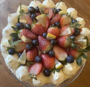 A photo of a cake decorated with fruit